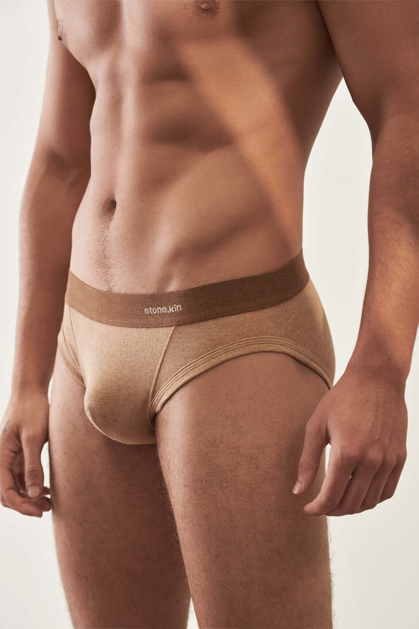 Men's Brief 3 Pack in Organic Cotton in camel shade, showcasing a model wearing soft, breathable underwear.