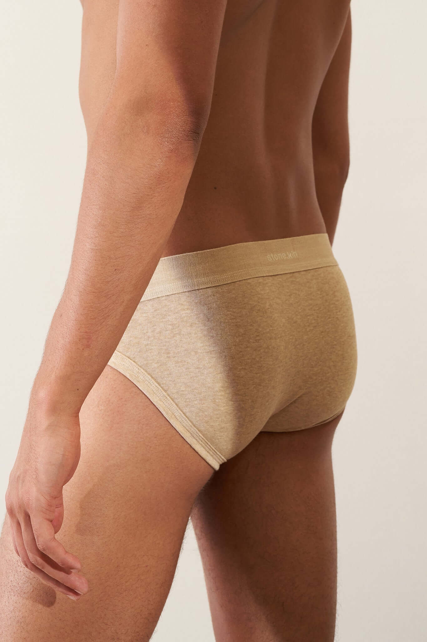 Men's Brief 3 Pack in Organic Cotton displayed on a model, showcasing the Sand color and classic fit.