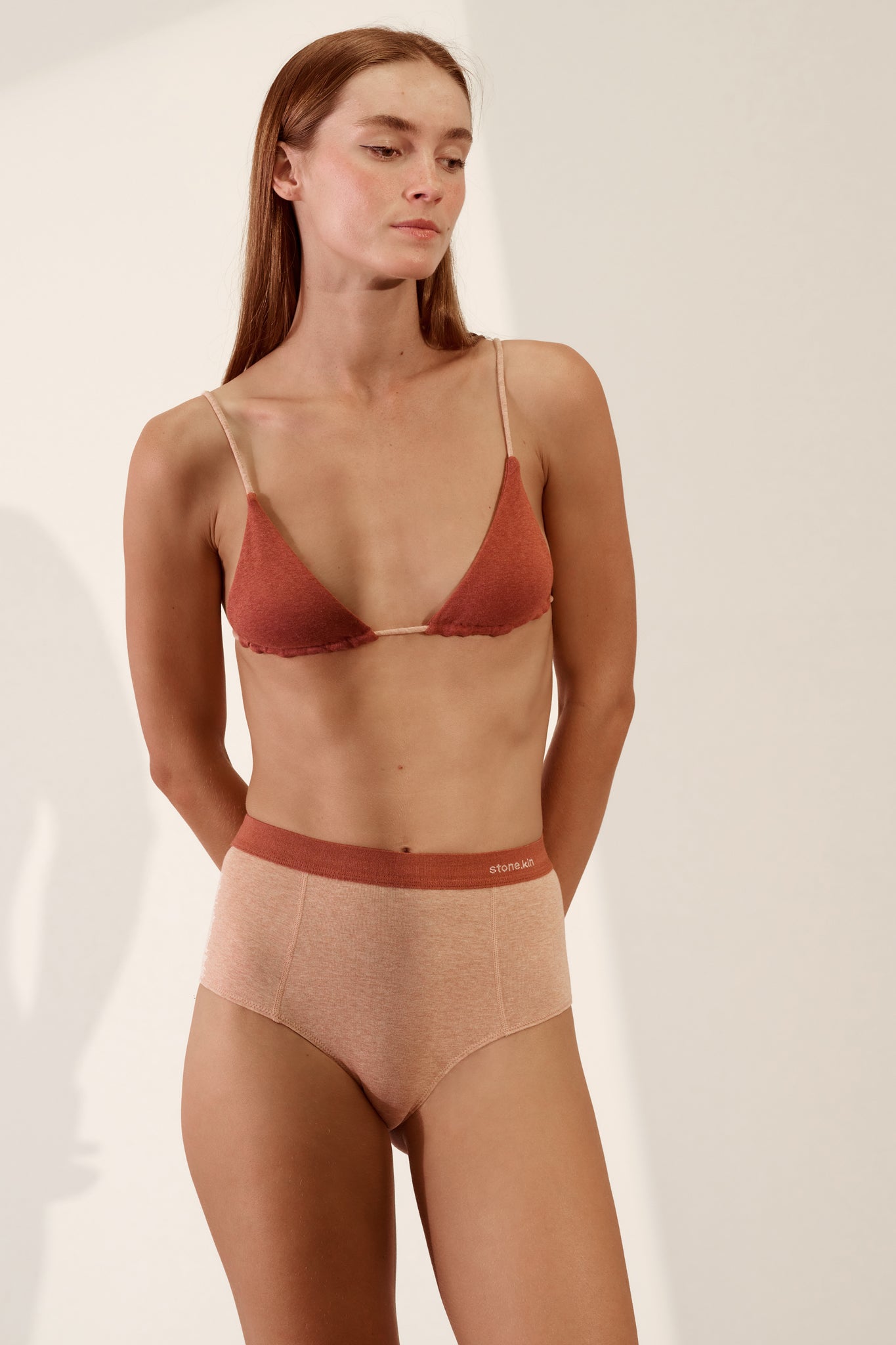 Stone.kin Women's Organic Cotton Rib Hi Brief in Nude and Rust colours, offering comfort and breathability. Ethically made from soft, sustainable organic cotton.