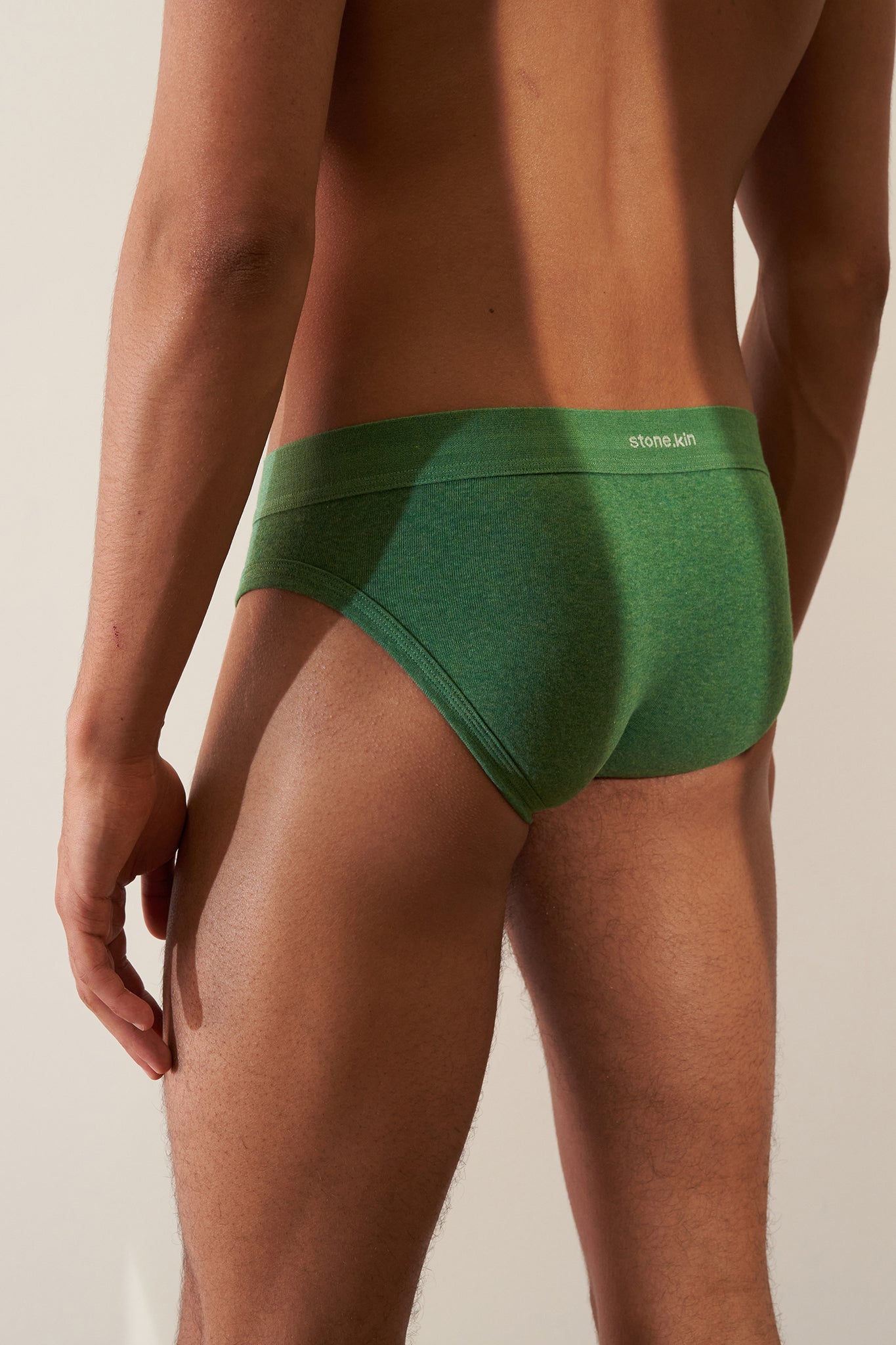 Stonekin Men's Organic Cotton Brief 3-Pack in Papaya, Sand, and Pandanus colours, featuring a classic fit in soft organic cotton.
