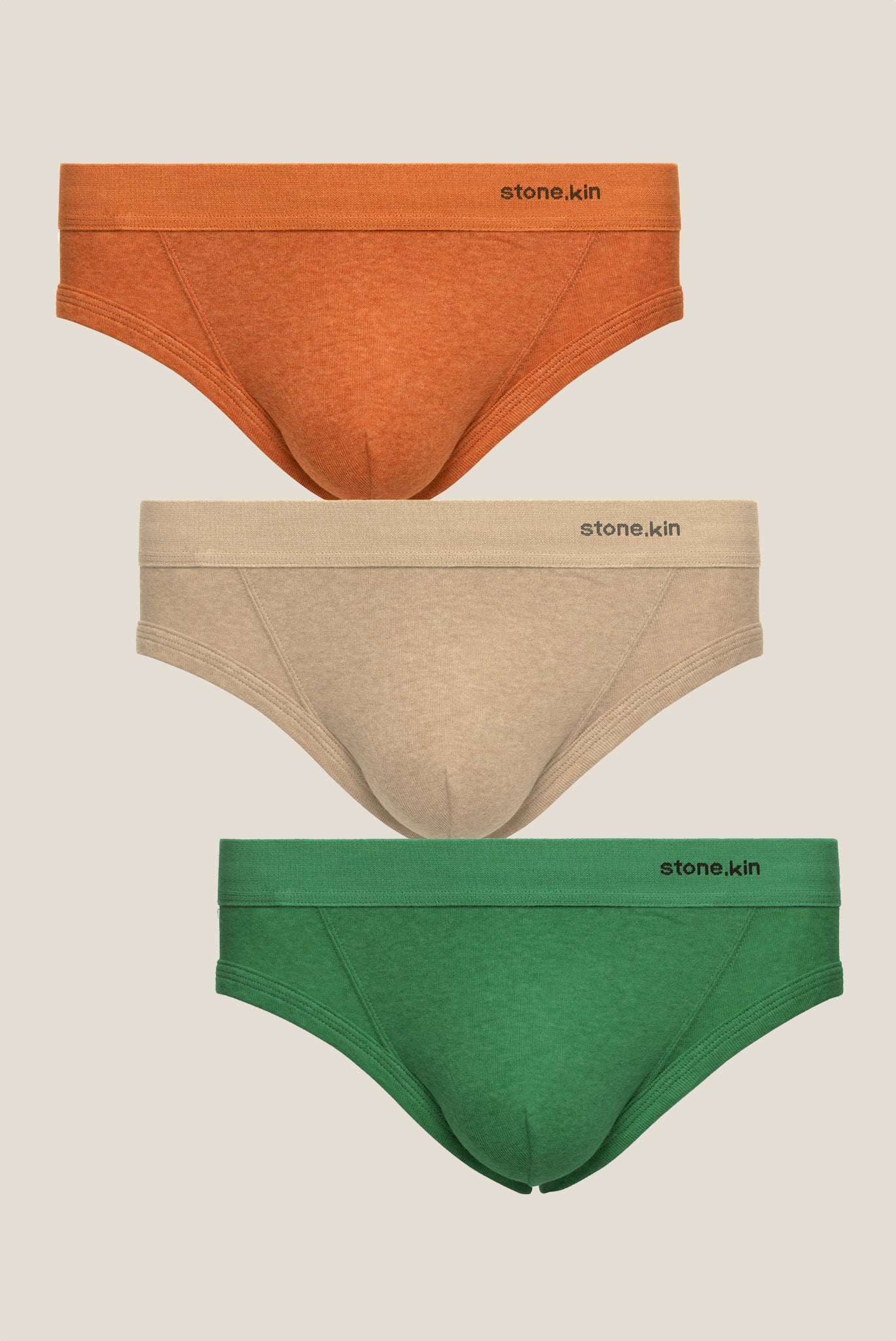 Stonekin Men's Organic Cotton Brief 3-Pack in Papaya, Sand, and Pandanus colours, featuring a classic fit in soft organic cotton.